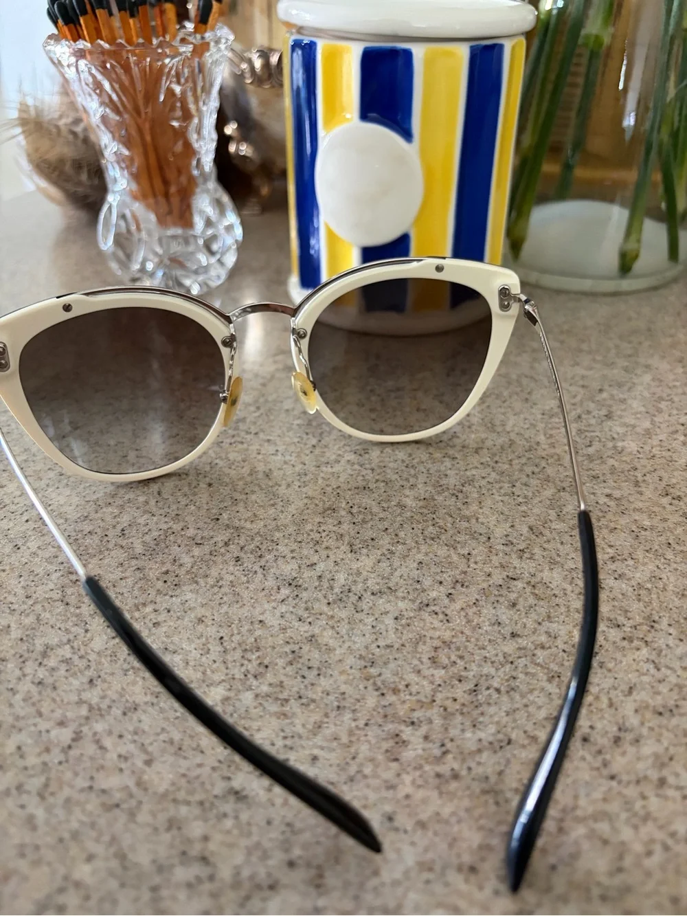 Prada Black and Gold Cat-Eye Sunglasses with Gradient Lenses